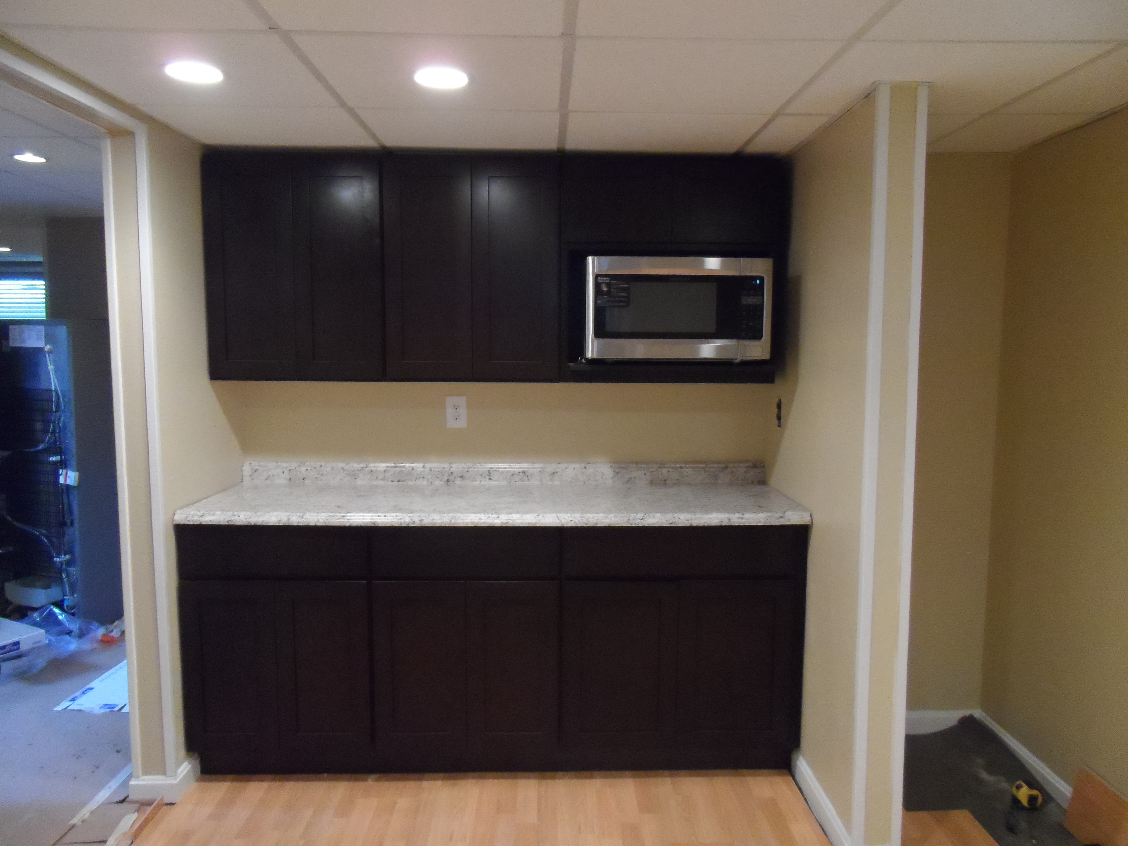 Basement room with kitchen after image 5