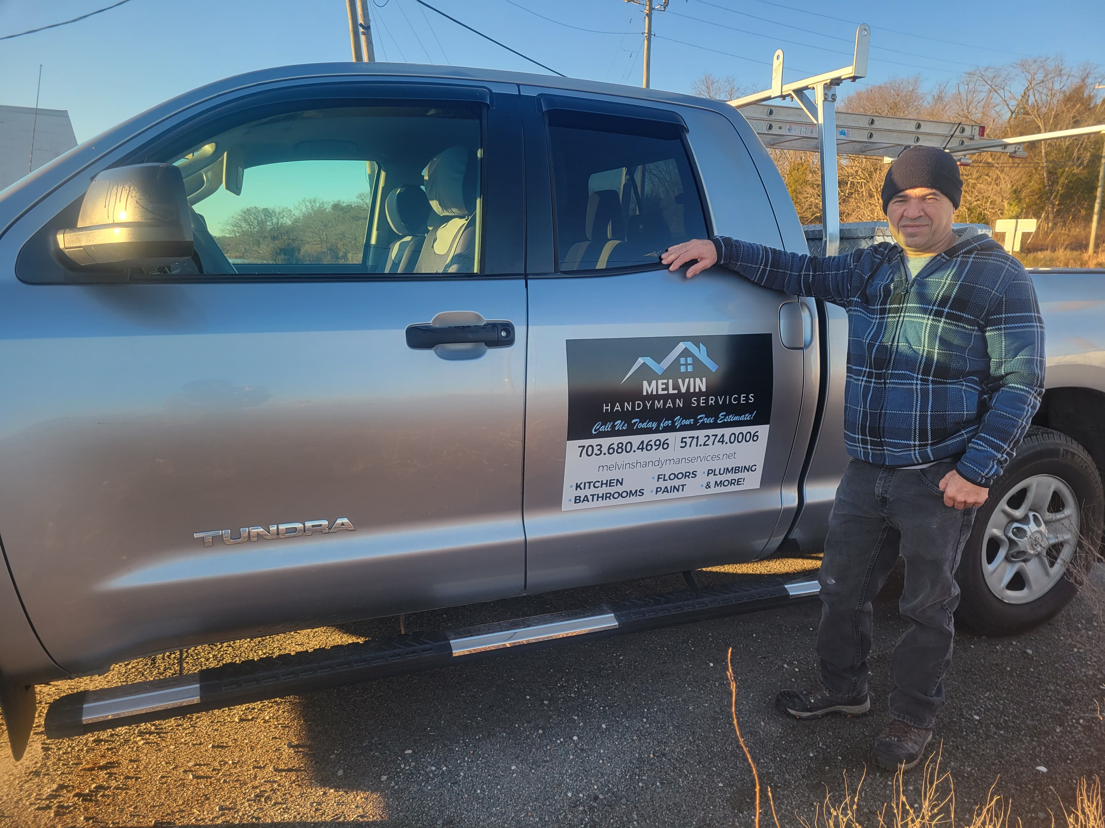 Melvin standing beside a vehicle, representing Melvin's Handyman Services